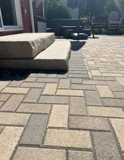Paver patio installation with stone steps by Weadickbros Landscape Design & Build