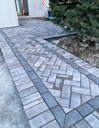 Herringbone patterned walkway installation by Weadickbros Landscape Design & Build