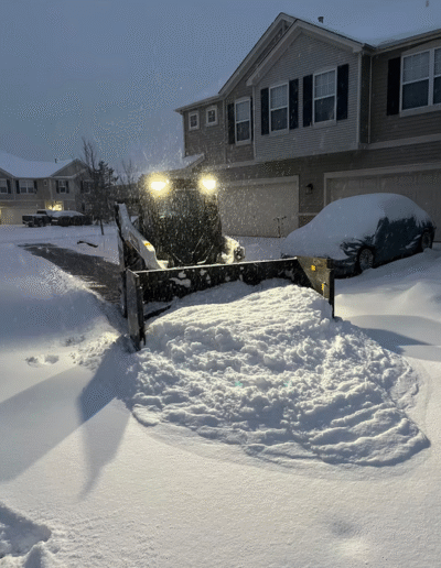 Snow plowing in residential area by Weadickbros Snow & Ice Management