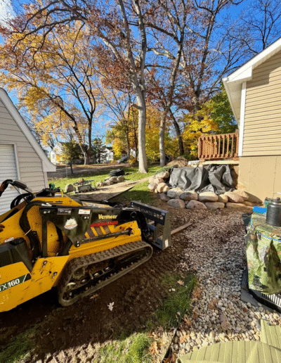 Excavation equipment preparing site for landscaping by Weadickbros Landscape Design & Build