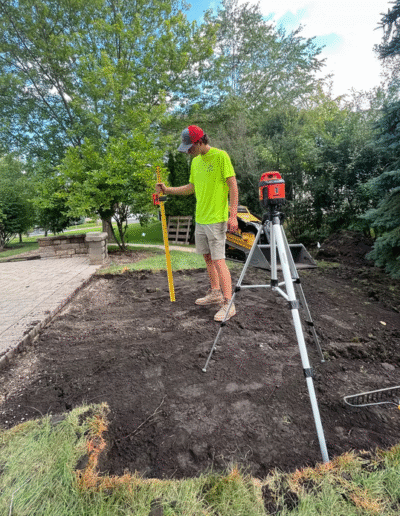 Measuring land for a landscaping project by Weadickbros Landscape Design & Build