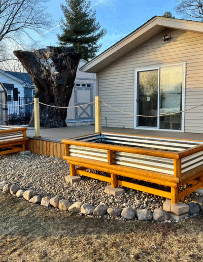 Raised garden beds and a deck area designed by Weadickbros Landscape Design & Build.
