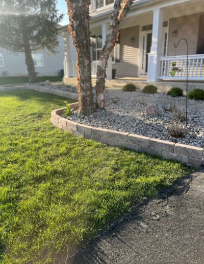 Vibrant flower bed and landscaped border by Weadickbros Landscape Design & Build