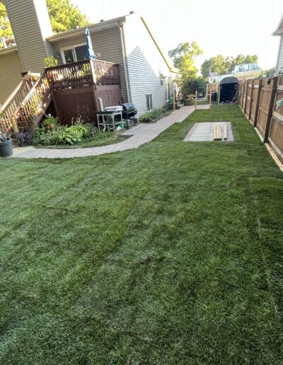 Newly installed sod in a residential backyard by Weadickbros Lawn & Landscape.